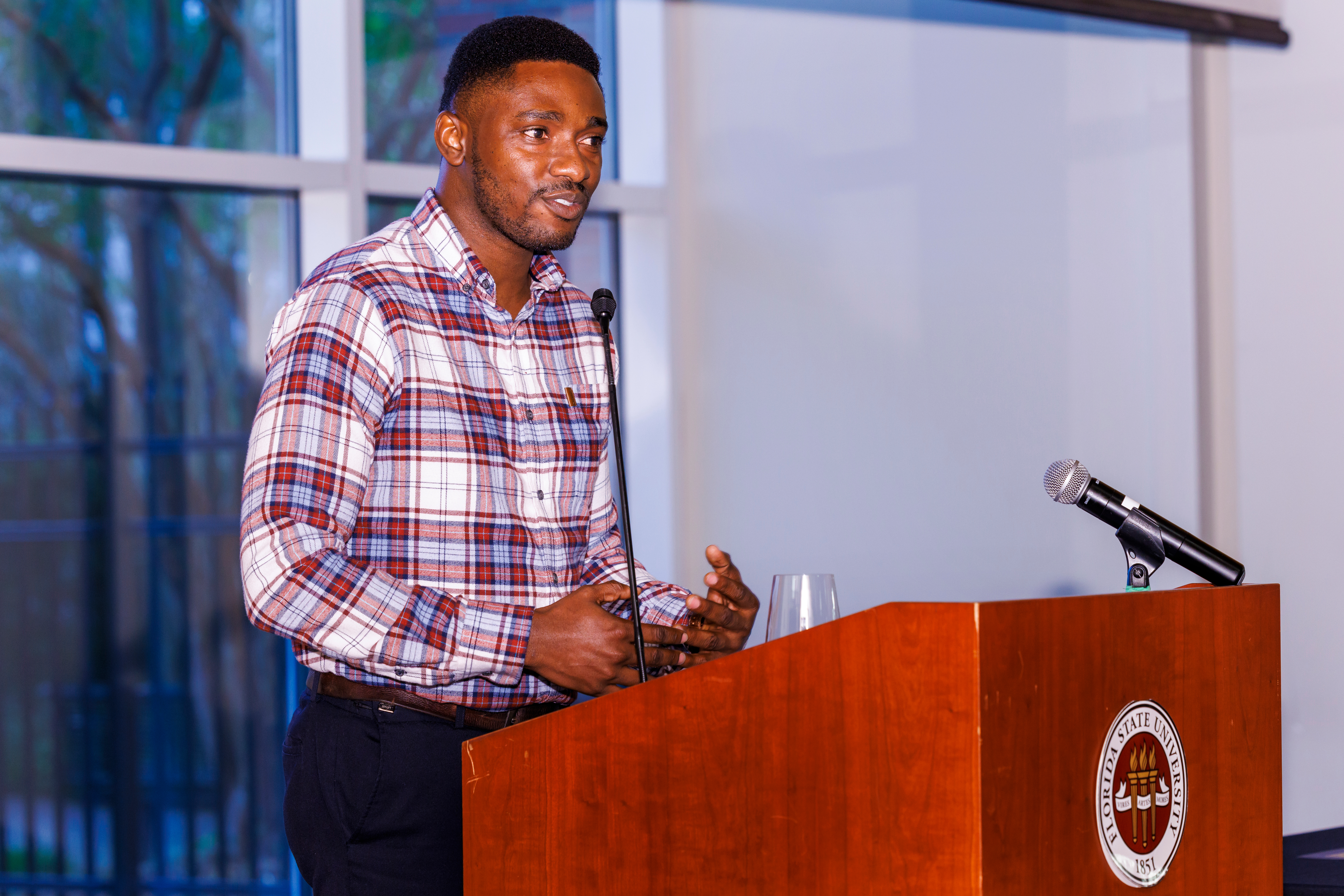 Samuel Kwawukume speaking at an FSU podium